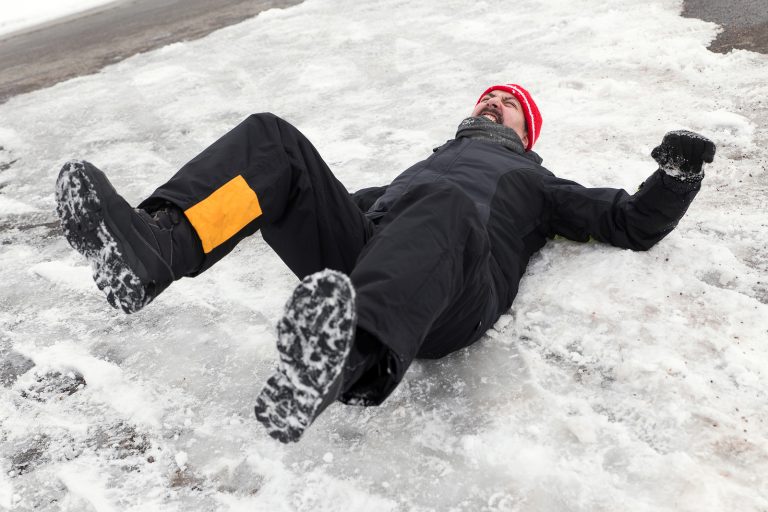 Man Is Lying On A Icy Way