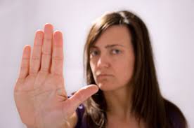 woman holding up hand to stop