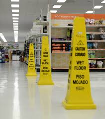 wet floor signs in supermarket